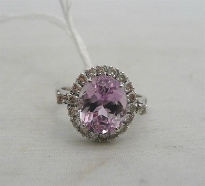 Lot 64 - A 14ct white gold kunzite and diamond cluster ring