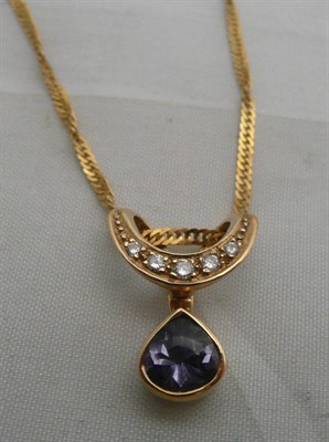 Lot 68 - A 9 carat gold diamond set pendant on chain