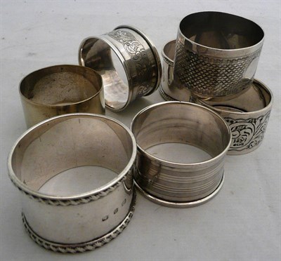 Lot 77 - Six silver napkin rings and a plated napkin ring, 4oz