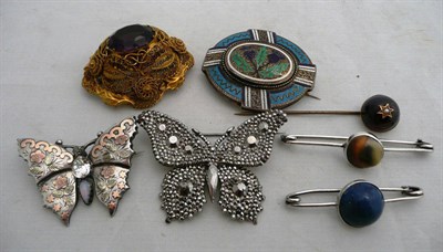 Lot 82 - Six brooches and a stick pin