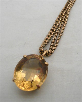 Lot 86 - A citrine pendant on a 9ct gold double strand chain