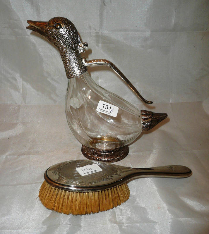 Lot 131 - A silver backed hair brush and a plate-mounted duck decanter