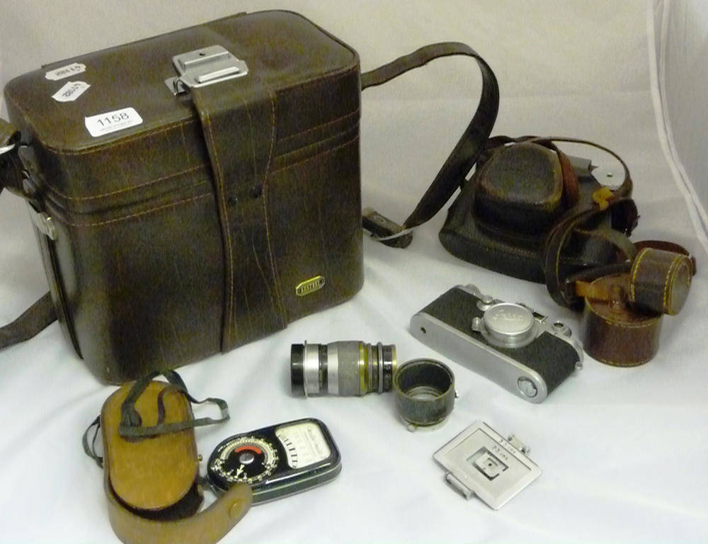 Lot 1158 - A Leica IIIc Camera No.473605, in chrome, circa 1949, with Elmar f3.5/580mm lens, in a stitched...
