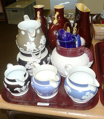 Lot 29 - Six various relief moulded jugs, blue glazed jug, pair of moon flasks and a matching glass