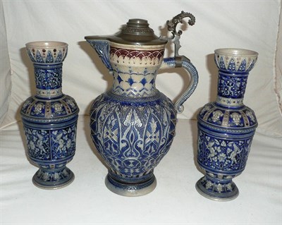 Lot 36 - A large German stoneware jug with pewter mounts and a similar pair of vases