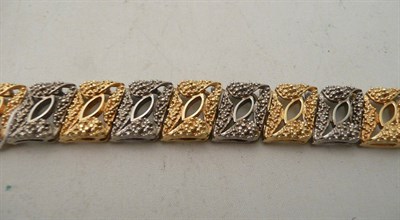 Lot 60 - An 18ct gold two colour bracelet
