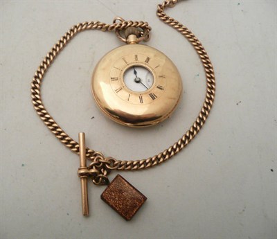 Lot 66 - A half hunter pocket watch stamped 14k and a 9ct gold watch chain