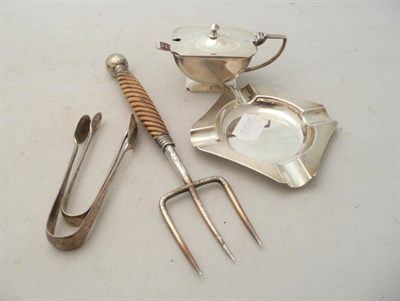 Lot 74 - Silver ashtray, silver mustard and spoon, two pairs of sugar tongs and plated toasting fork