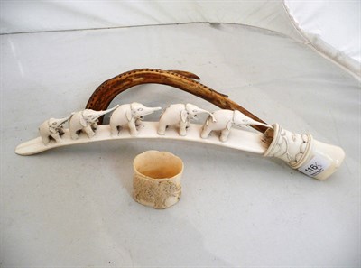Lot 116 - A carved elephant bridge, elephant carved napkin ring and an antler cribbage board