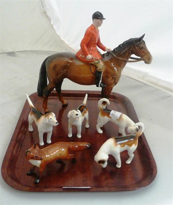 Lot 118 - A Beswick huntsman on a horse with four hounds and a fox (a.f.)
