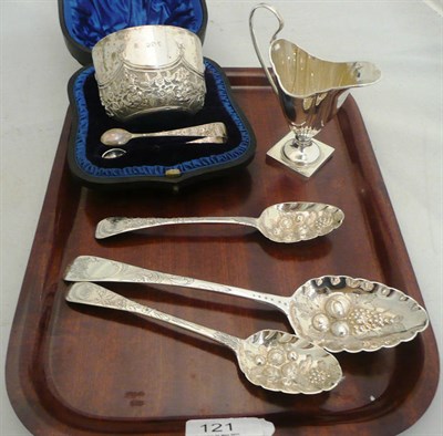 Lot 121 - Three silver berry spoons, sugar bowl and tongs (cased) and a cream jug