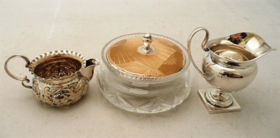 Lot 166 - Two silver jugs and a cut glass powder bowl with lid