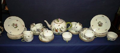 Lot 183 - A Herend Porcelain twelve setting tea service in the Rothschilds Bird pattern, comprising tea...