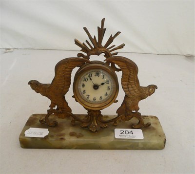 Lot 204 - Clock on onyx stand