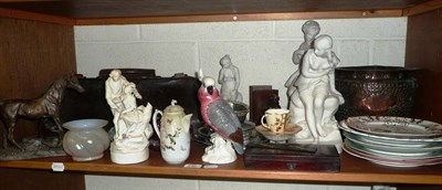 Lot 248 - A shelf including Parian figures, painted plates, spelter horse, Gladstone bag, Vienna...
