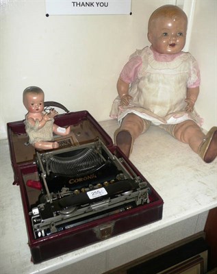 Lot 255 - Two dolls and a childs Coroma typewriter