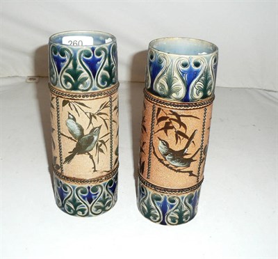 Lot 260 - A pair of Doulton stoneware vases by Florence E Barlow, decorated with birds (one cracked)