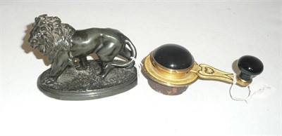 Lot 285 - Gilt metal mounted butler's bell pull and a spelter figure of a lion