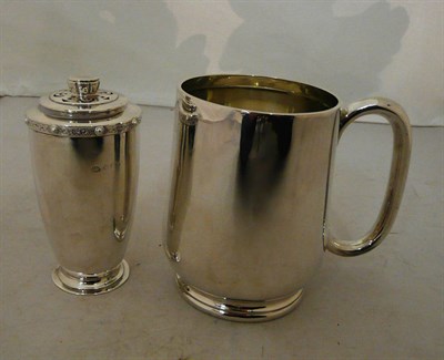 Lot 46 - A silver mug and caster, 15oz approximate weight