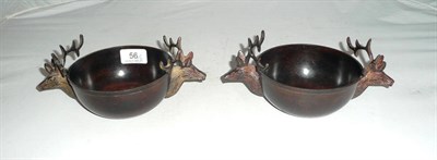 Lot 56 - A pair of bronze stag twin-handled bowls