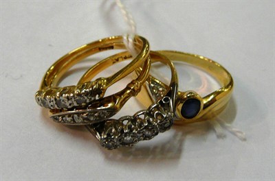 Lot 85 - Three diamond set rings and a contemporary sapphire-set ring stamped '750'