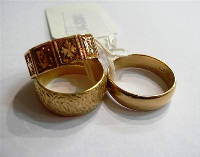 Lot 102 - Two 18ct gold band rings and another