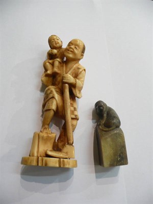 Lot 108 - Ivory figure and a soapstone pig