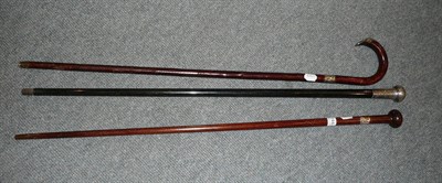 Lot 144 - Two silver mounted walking canes and another gold mounted