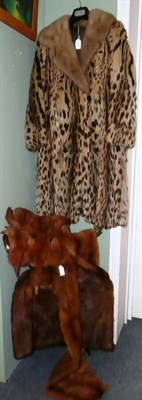 Lot 145 - Circa 1920's leopardskin coat, mink capelet, stole and a muff