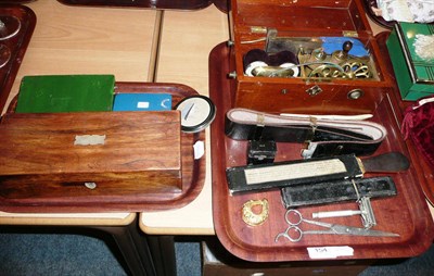 Lot 154 - A shock machine, barbers items, etc, on two trays