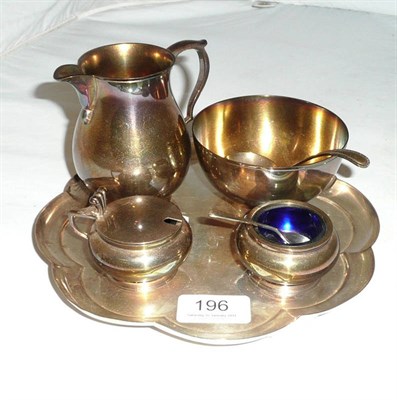 Lot 196 - A silver milk jug and sugar bowl and matching silver mustard and salt, a silver tray, a silver salt