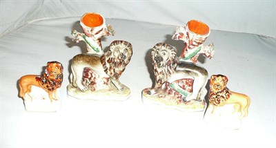 Lot 200 - A pair of small Staffordshire lion spill vases and a small pair of lions (4)