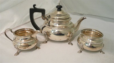 Lot 220 - A silver three piece tea set, Birmingham assay