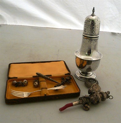 Lot 231 - A silver sugar sifter (4.32oz), child's rattle (a.f.) and a silver fork, etc