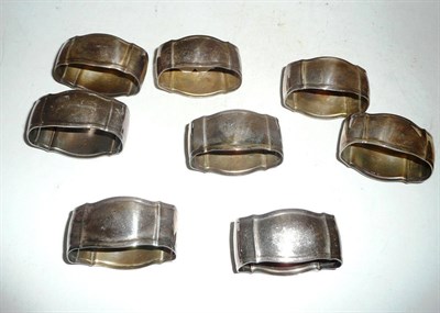 Lot 240 - A set of eight silver napkin rings stamped '925'