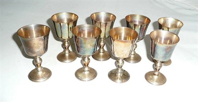 Lot 251 - A set of eight silver sherry goblets, 19oz approx