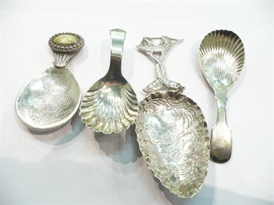 Lot 254 - A Georgian silver caddy spoon, a similar plated example, a Continental silver caddy spoon with...