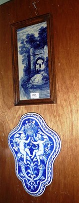 Lot 261 - Framed tile and a Delft plaque