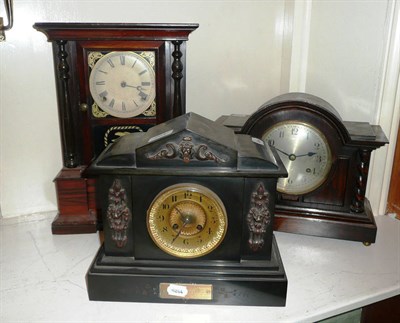 Lot 264 - Shelf clock, black slate clock, oak mantel clock and an oak barometer (4)