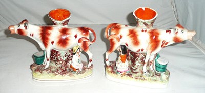 Lot 291 - A pair of Staffordshire cow creamer spill vases