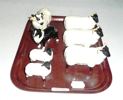 Lot 332 - Three Beswick ewes, a ram, sheep dog and two lamps