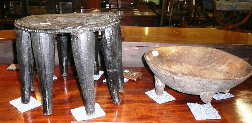 Lot 506 - A Fijian wood Kava bowl, of deep circular form with two fin shape handles, on four tapering...