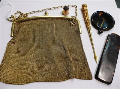 Lot 1 - A rolled gold purse, a cased thimble, a comb, a mirror, a spear shaped nut pick
