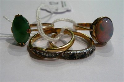 Lot 12 - A jade ring marked '10k', a simulated opal ring and two dress rings