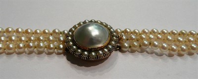 Lot 25 - Three strand pearl necklace