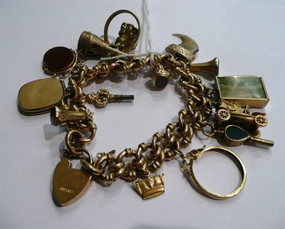 Lot 35 - A charm bracelet hung with assorted charms