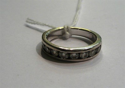 Lot 43 - An 18ct white gold diamond half eternity ring