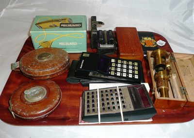 Lot 88 - Calculators, microscope, steel tape measures, razors, biro, etc