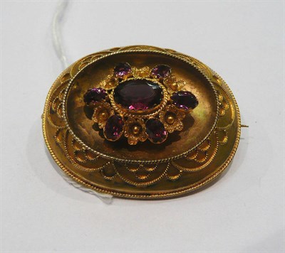 Lot 392 - A Victorian amethyst set oval brooch, cased