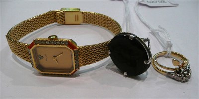 Lot 399 - An intaglio ring, a diamond ring, a dress ring and a watch